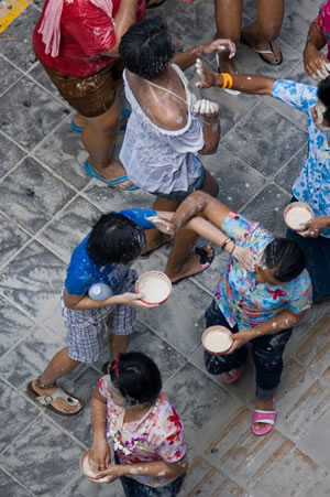 Songkran Festival in Thailand. Thai women play their part in this Thai cultural event as well as the Thai men.